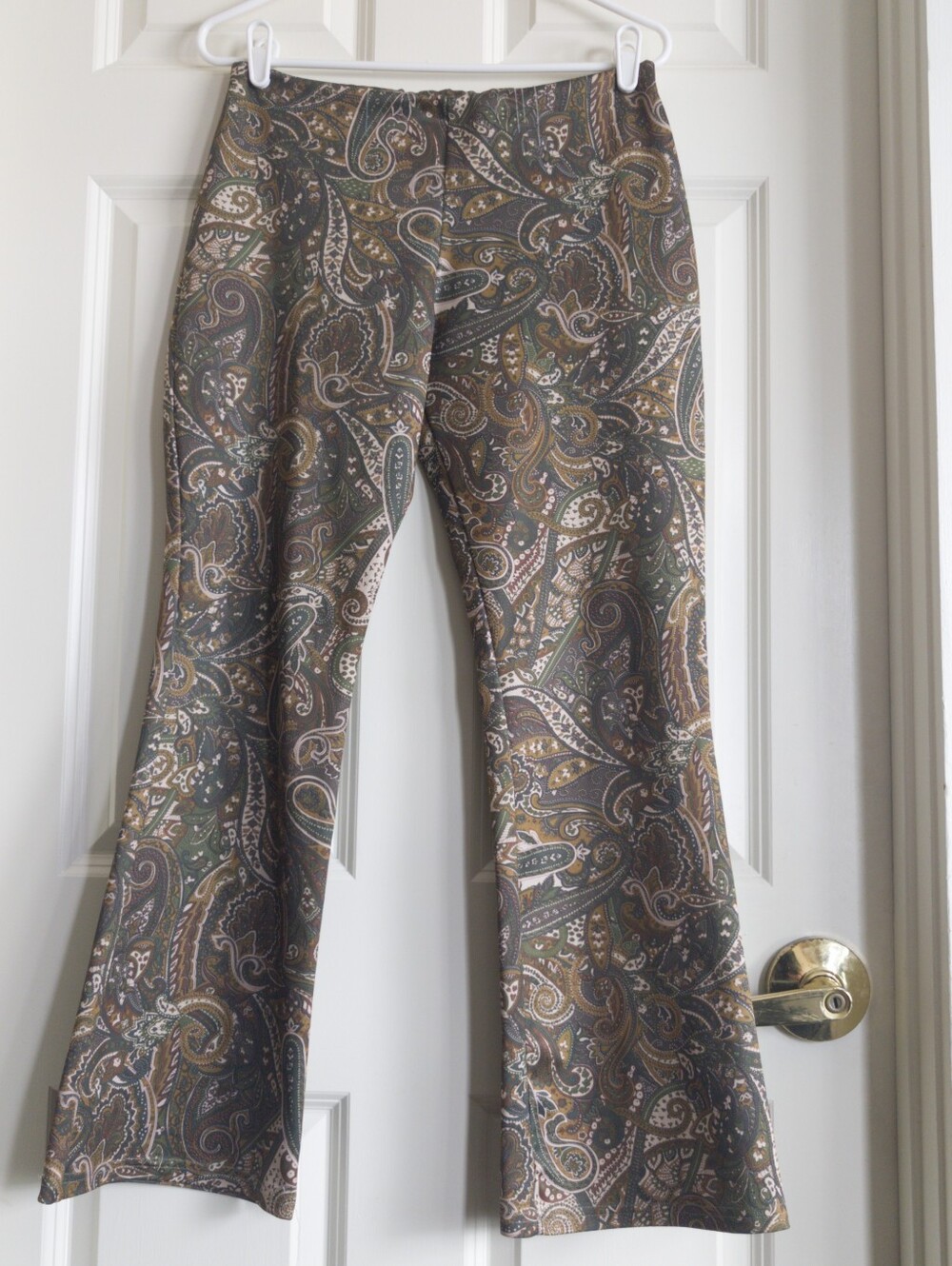 Vintage late 90s or Y2K mid rise olive green and tan paisley stretch flares